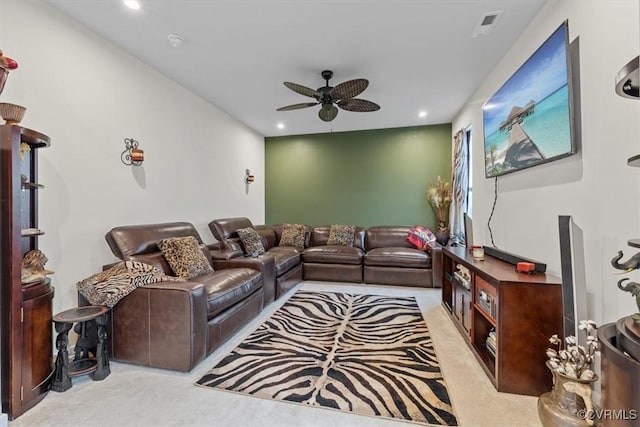 living room with light carpet and ceiling fan