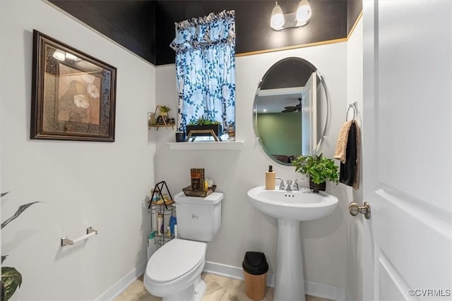 bathroom featuring sink and toilet