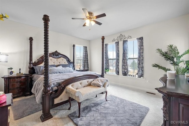 bedroom featuring light carpet and ceiling fan