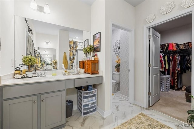 bathroom with vanity and toilet