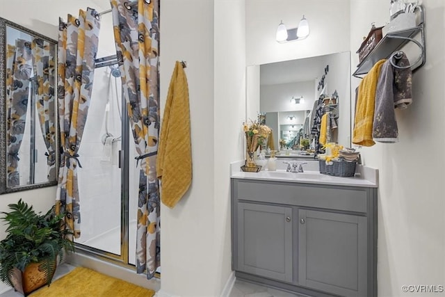 bathroom with vanity and walk in shower