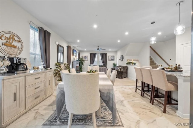 dining room featuring ceiling fan