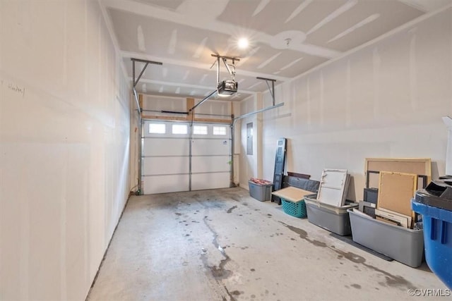 garage featuring a garage door opener and electric panel