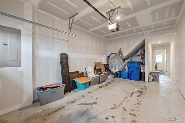 garage with a garage door opener and electric panel