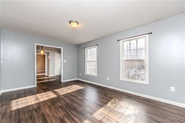 unfurnished room featuring dark hardwood / wood-style floors