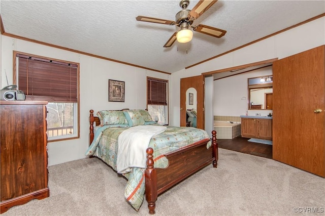 bedroom with connected bathroom, light carpet, a textured ceiling, and ceiling fan