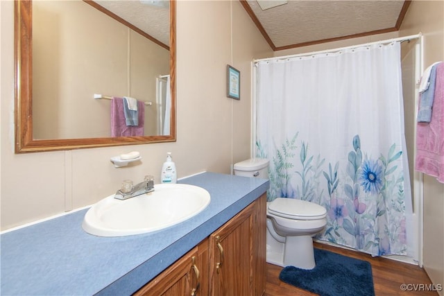 full bathroom featuring crown molding, vanity, hardwood / wood-style floors, and a textured ceiling