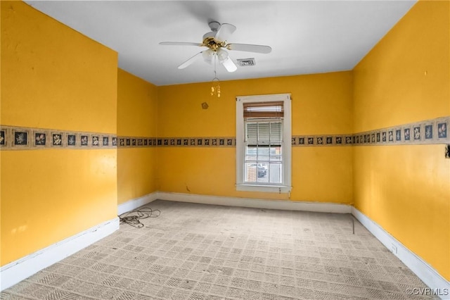 carpeted empty room with ceiling fan