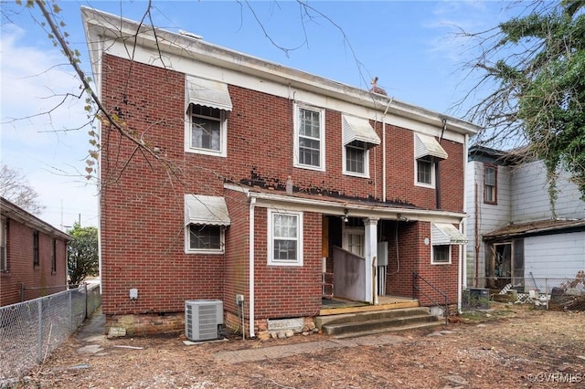 rear view of property with central AC unit