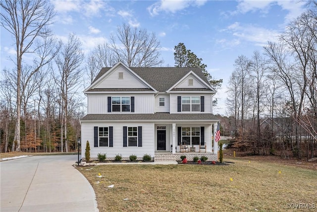 view of front facade with covered porch and a front lawn