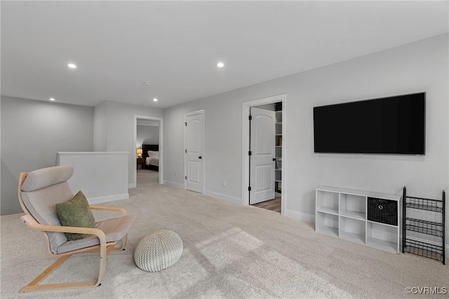 sitting room featuring baseboards, carpet flooring, and recessed lighting