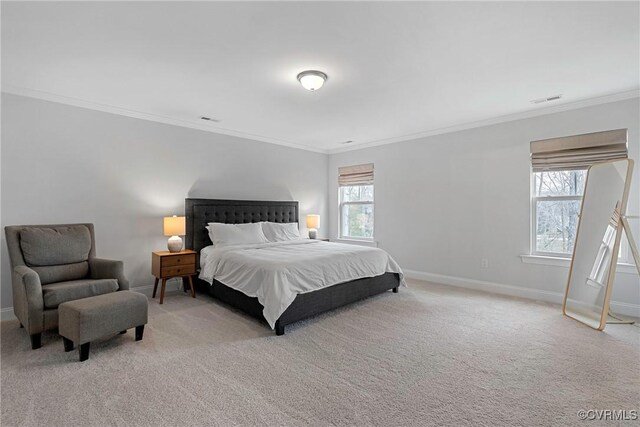 bedroom with baseboards, crown molding, visible vents, and light colored carpet