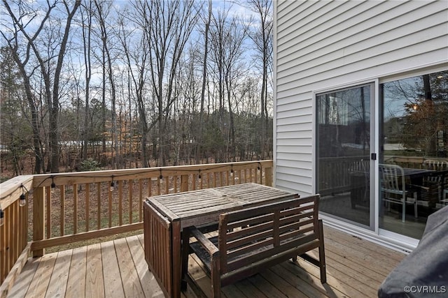 deck with outdoor dining space