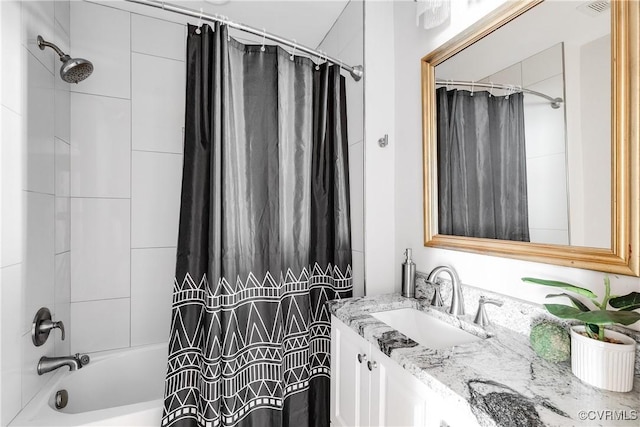 bathroom featuring vanity and shower / tub combo