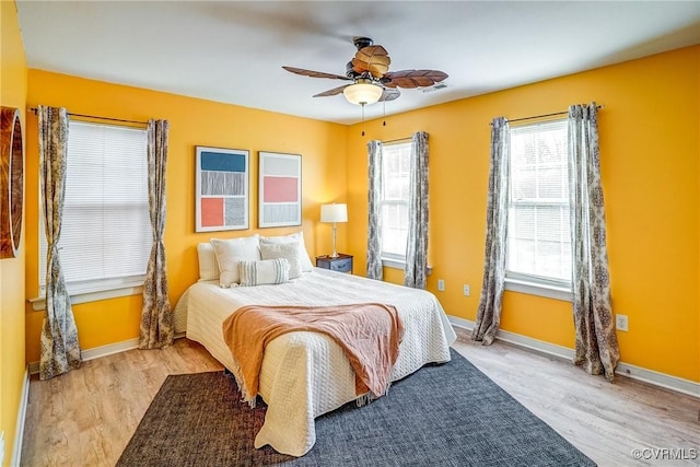 bedroom featuring ceiling fan and light hardwood / wood-style floors