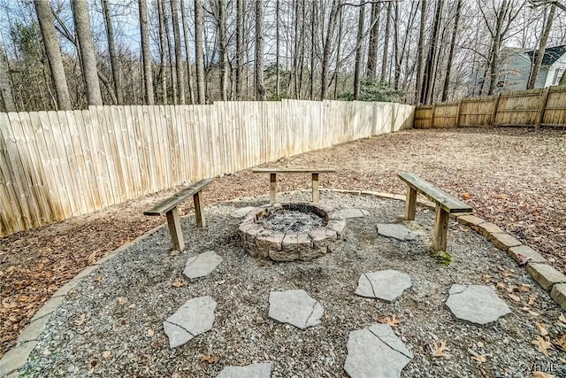 view of yard with an outdoor fire pit