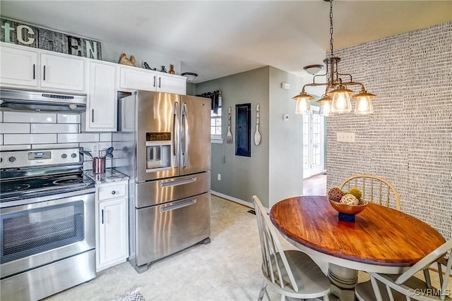 kitchen with white cabinetry, brick wall, stainless steel appliances, and range hood