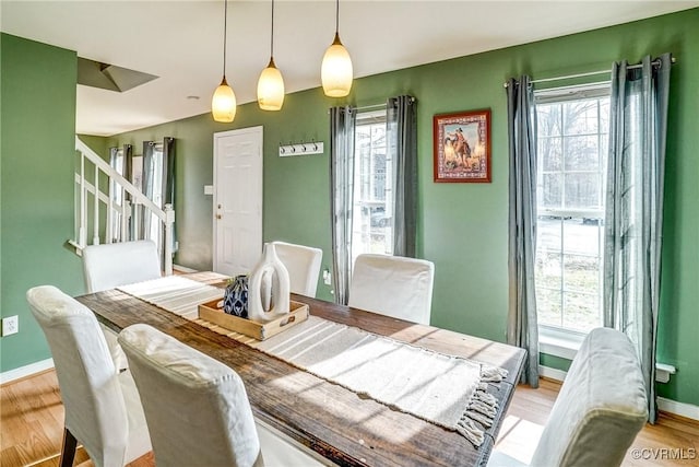 dining room with light wood-type flooring