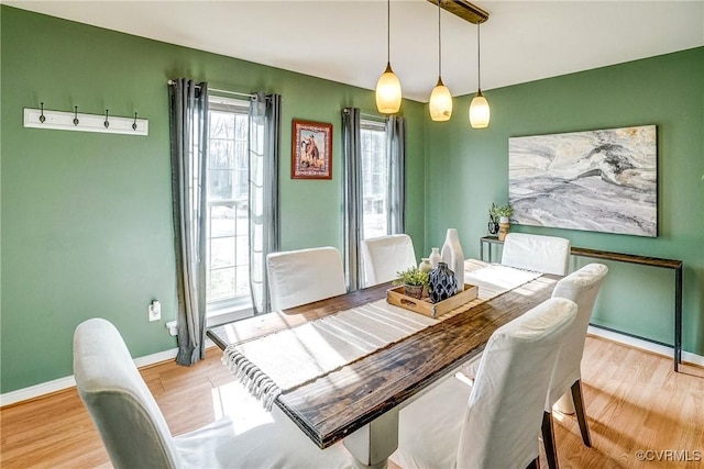 dining area featuring light wood-type flooring