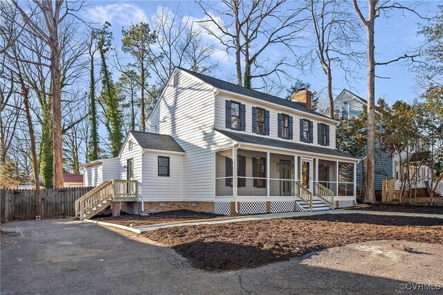 view of front of home featuring a sunroom