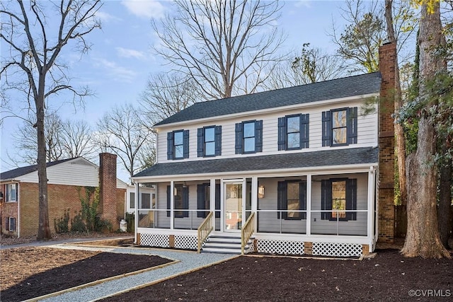 view of front of home featuring a porch and a sunroom