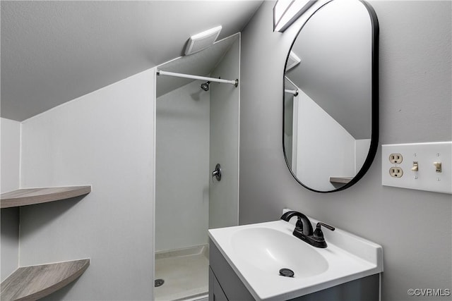 bathroom with vanity and a shower