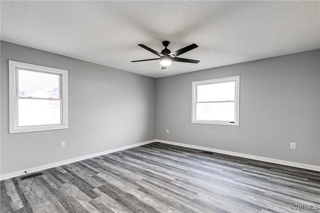 unfurnished room featuring wood-type flooring, ceiling fan, and a textured ceiling