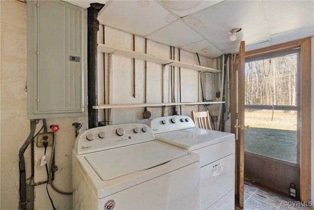 laundry area with separate washer and dryer and electric panel