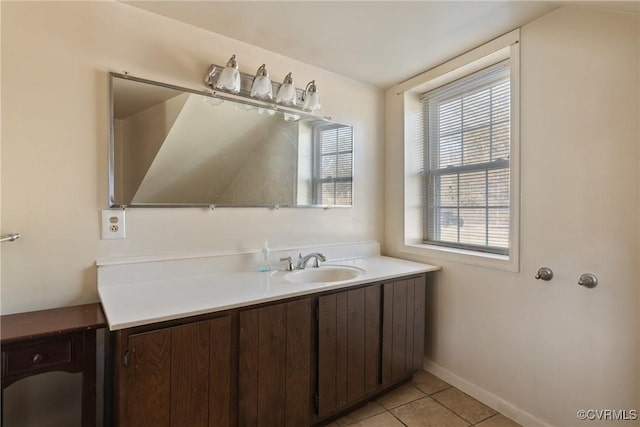 bathroom with tile patterned flooring and vanity