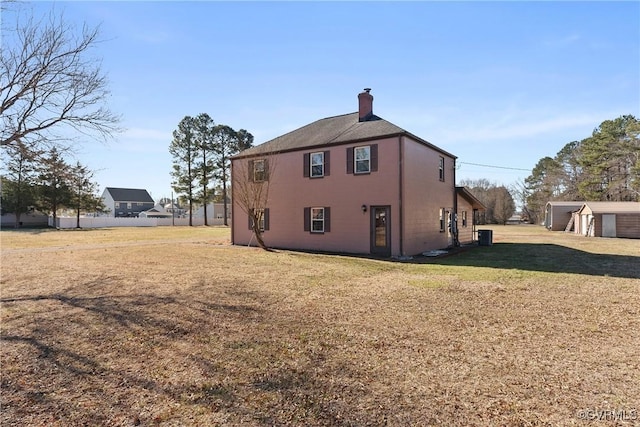 view of side of property with a yard