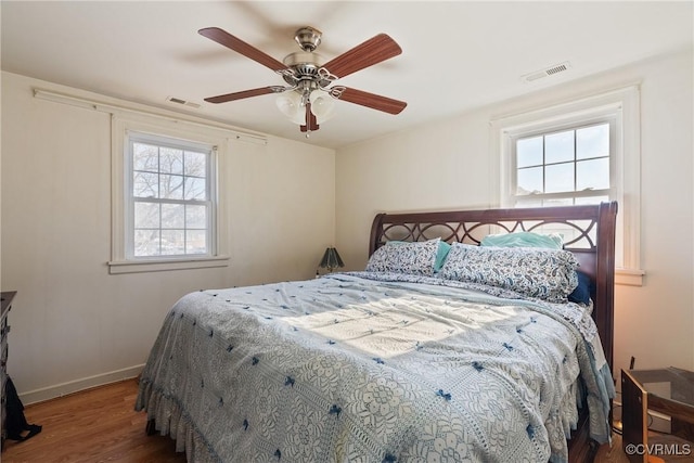 bedroom with hardwood / wood-style floors and ceiling fan