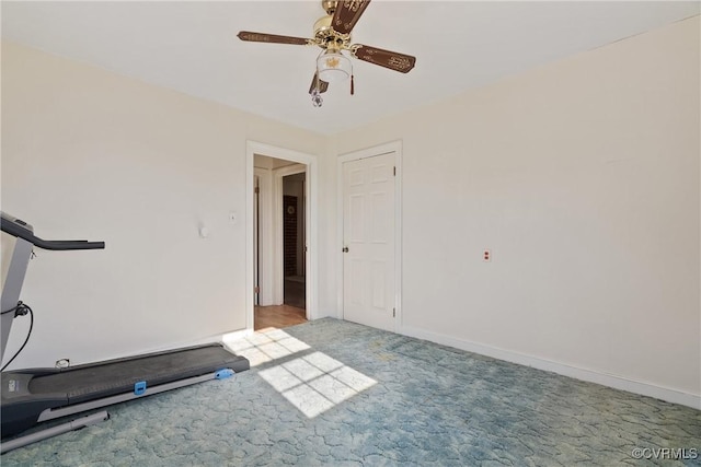 workout room featuring ceiling fan