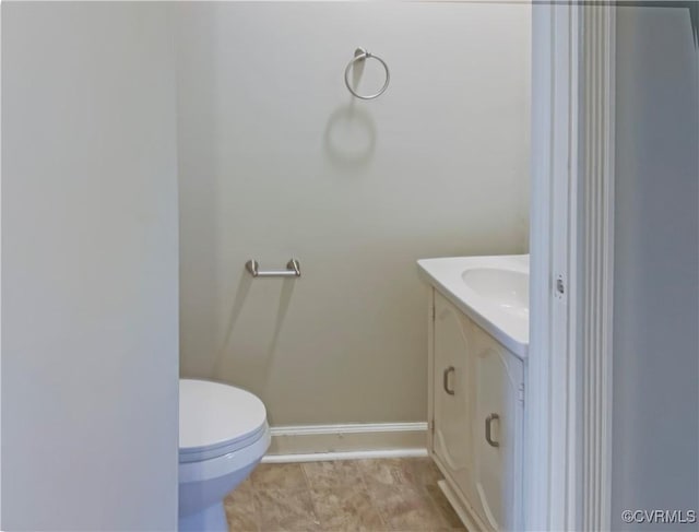 bathroom with vanity, tile patterned floors, and toilet