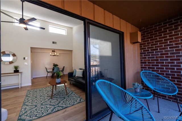 interior space with ceiling fan