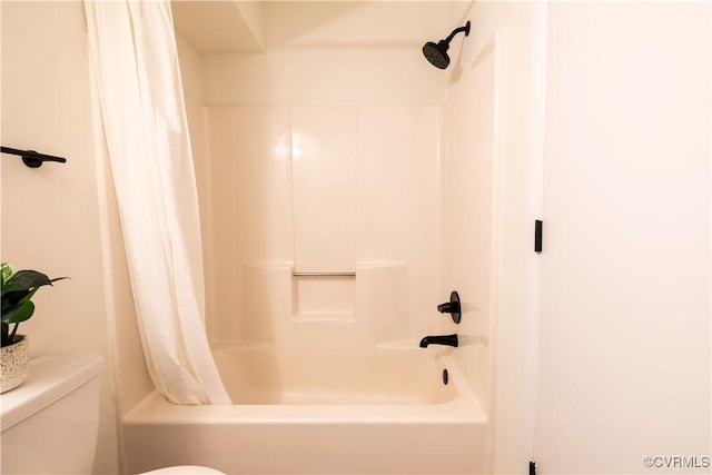 bathroom with toilet and shower / tub combo