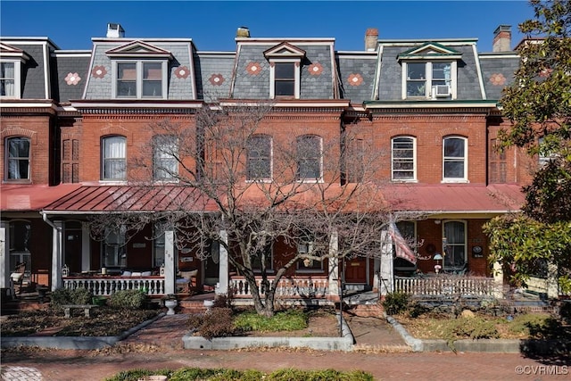 multi unit property featuring a porch