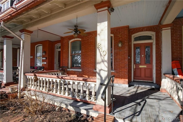 doorway to property with ceiling fan and covered porch