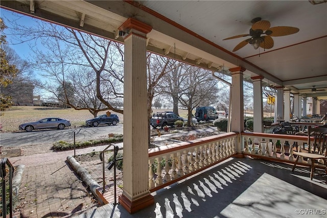 wooden deck featuring ceiling fan and a porch