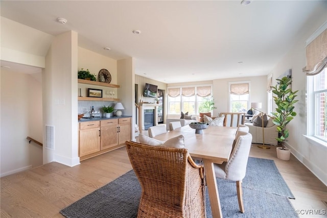 dining area featuring plenty of natural light and light wood-type flooring