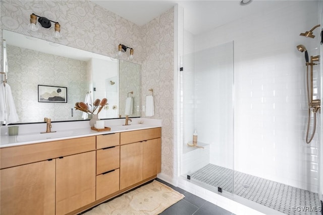 bathroom featuring an enclosed shower, vanity, and tile patterned flooring