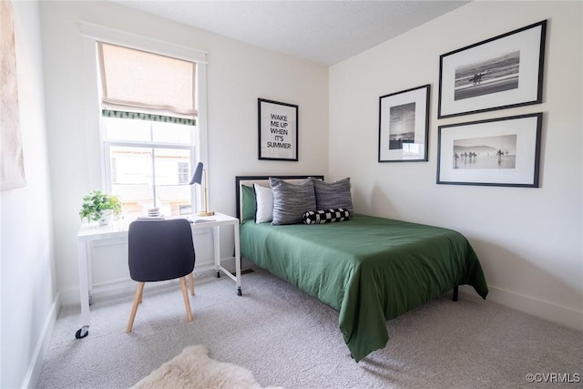 bedroom with light colored carpet