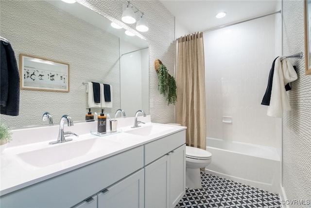 full bathroom with shower / tub combo with curtain, vanity, and toilet