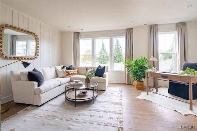 living room with a wealth of natural light and hardwood / wood-style floors