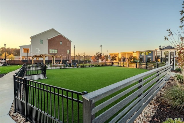 surrounding community with a yard and a gazebo