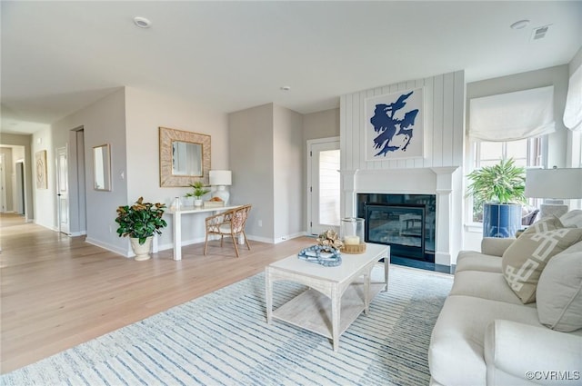 living room with light hardwood / wood-style flooring