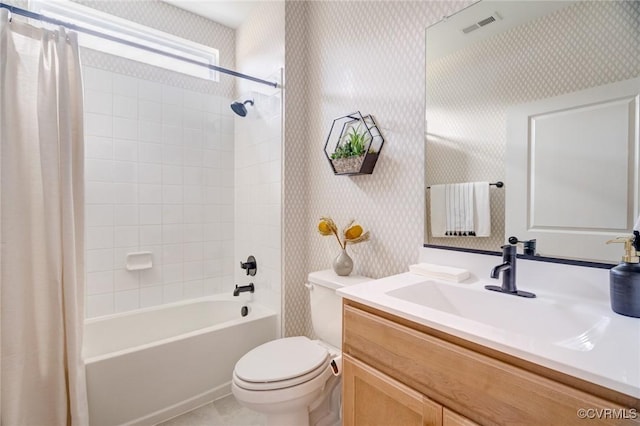 full bathroom featuring shower / bath combination with curtain, vanity, and toilet