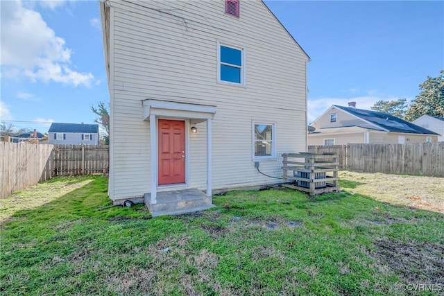 back of house with a yard