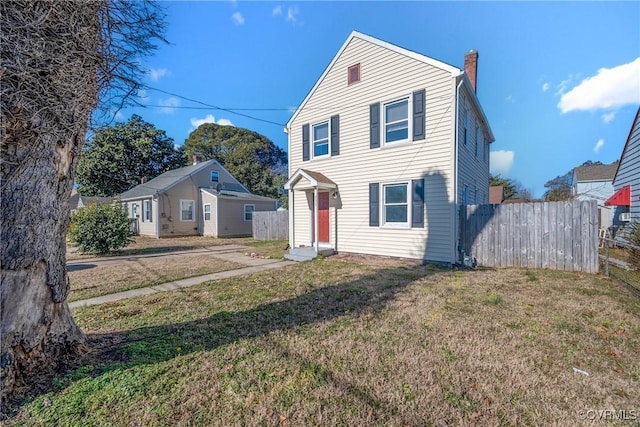 view of property featuring a front yard