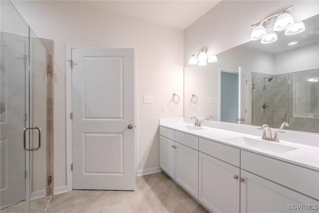 bathroom featuring vanity, an enclosed shower, and tile patterned flooring