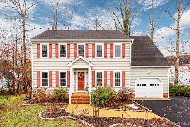 colonial inspired home with a garage